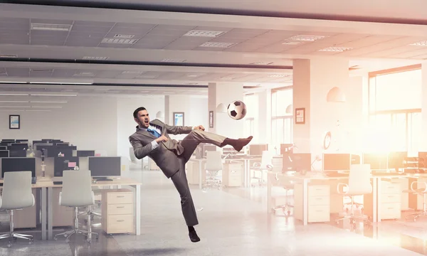 Playing football in office — Stock Photo, Image