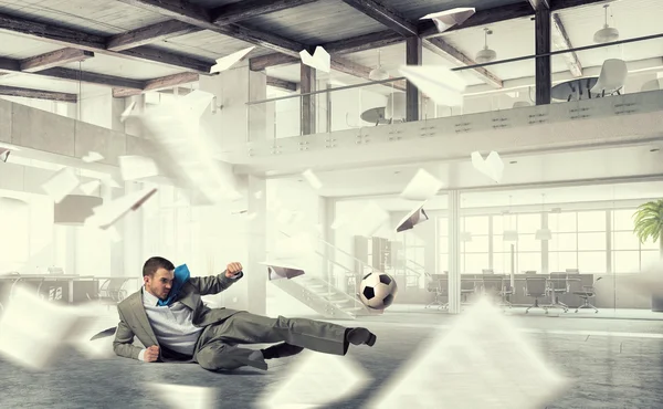 Playing football in office — Stock Photo, Image