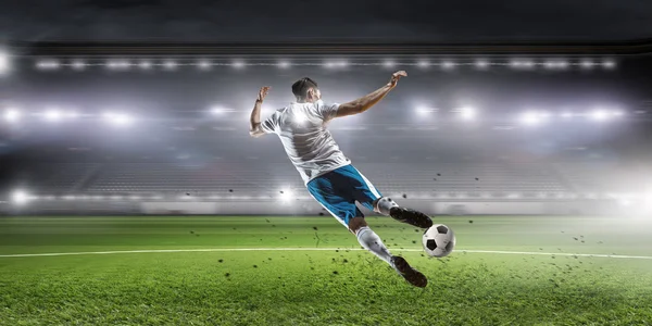 Soccer player hitting ball Royalty Free Stock Images