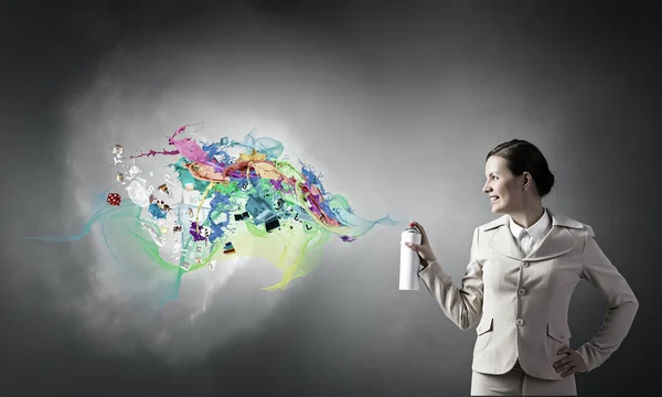 Woman use paint spray — Stock Photo, Image