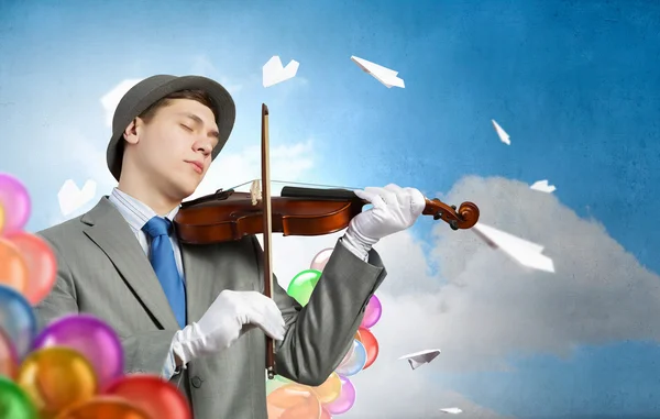 Man playing holiday melody — Stock Photo, Image