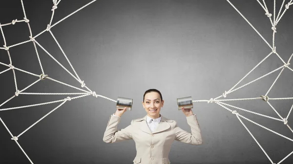 Mujer usando teléfono sordo. Medios mixtos — Foto de Stock