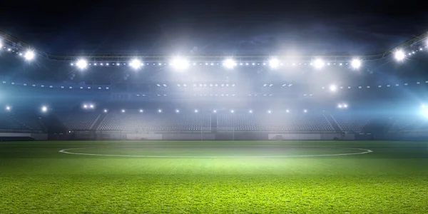 Estádio de futebol em luzes. meios mistos — Fotografia de Stock