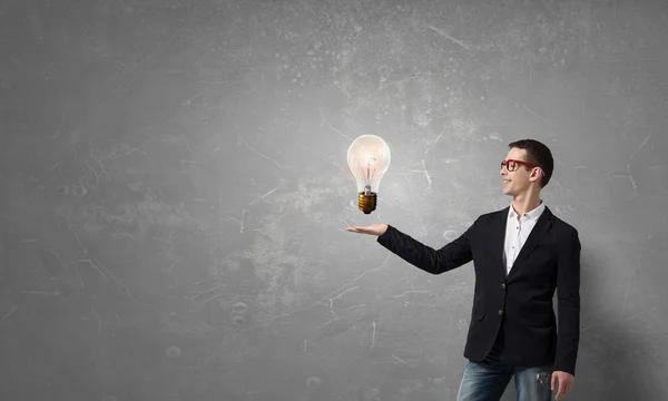 Guy presenting bright idea . Mixed media — Stock Photo, Image