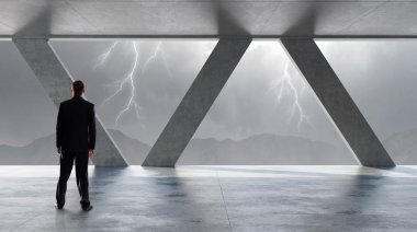 İş adamı pencereden bakıyor. Karışık teknik