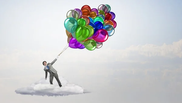 Hombre comediante con globos de color. Medios mixtos —  Fotos de Stock