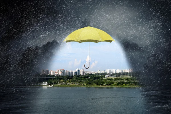 Color umbrella in sky . Mixed media — Stock Photo, Image