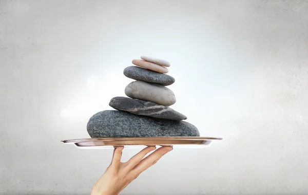 Stones massage procedure . Mixed media — Stock Photo, Image