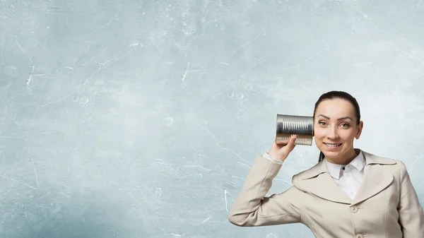 Woman using deaf phone . Mixed media — Stock Photo, Image