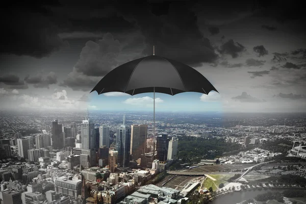 Black umbrella in sky . Mixed media — Stock Photo, Image