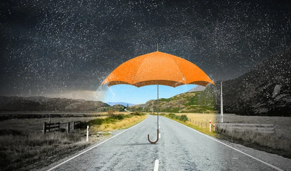 Color umbrella in sky . Mixed media — Stock Photo, Image