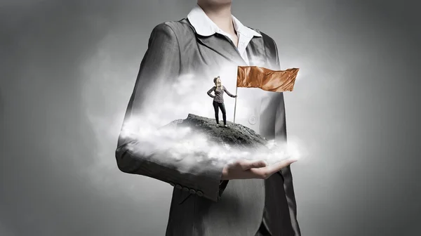 Woman with red waving flag . Mixed media — Stock Photo, Image