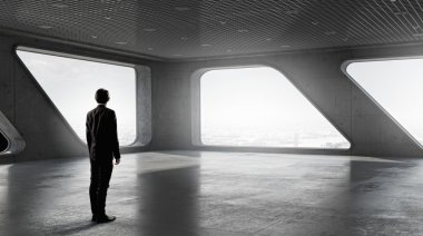 İş adamı pencereden bakıyor. Karışık teknik