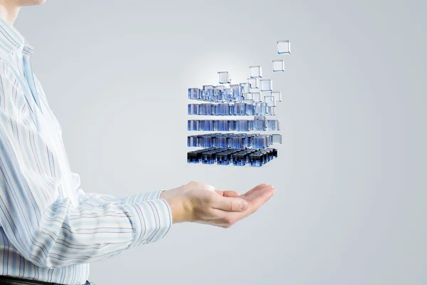 Cube in male hand . Mixed media — Stock Photo, Image