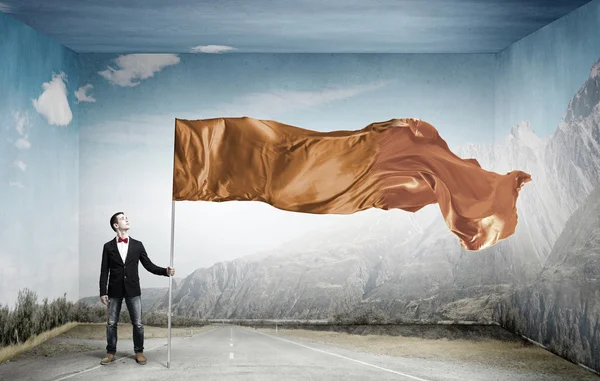 Un tipo con bandera ondeante. Medios mixtos — Foto de Stock