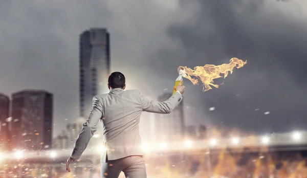 Businessman throwing petrol bomb .  Mixed media — Stock Photo, Image