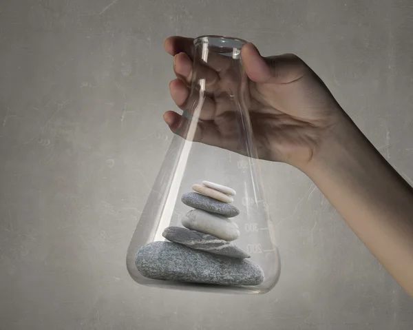 Stones in glass tube .  Mixed media — Stock Photo, Image