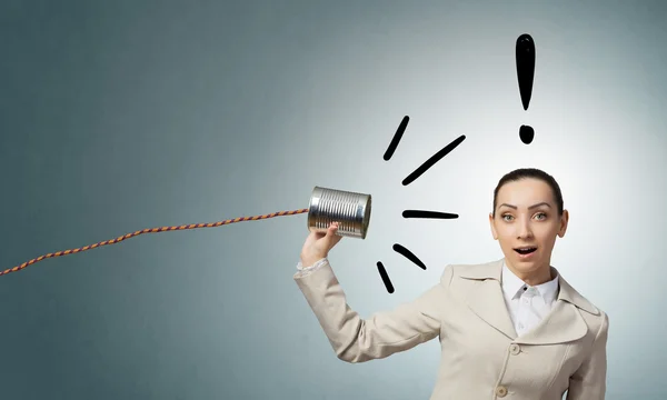 Woman using deaf phone  . Mixed media — Stock Photo, Image