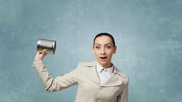 Mujer usando teléfono sordo. Medios mixtos —  Fotos de Stock