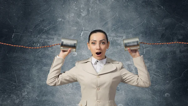 Woman using deaf phone  . Mixed media — Stock Photo, Image