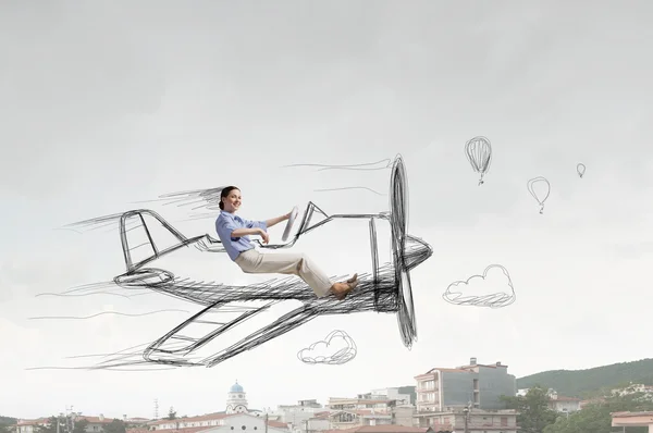 Woman in drawn airplane  . Mixed media — Stock Photo, Image