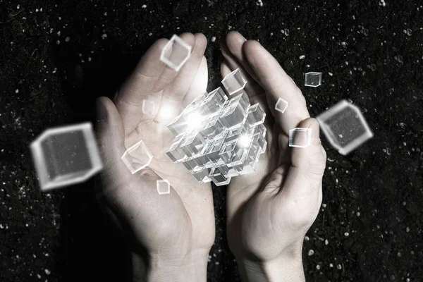 Cube in male hand . Mixed media — Stock Photo, Image