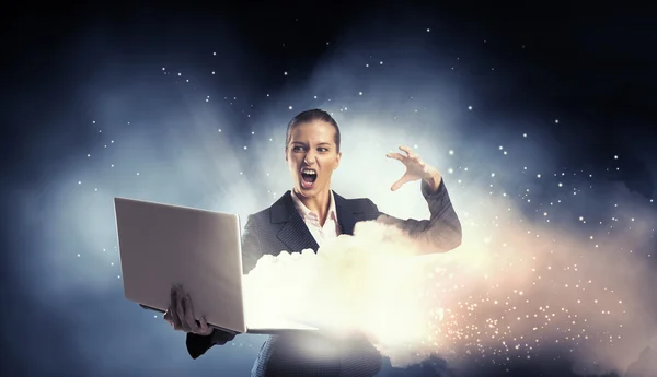 Woman with laptop in hands . Mixed media — Stock Photo, Image