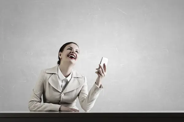 Attractive businesswoman having mobile conversation . Mixed media — Stock Photo, Image