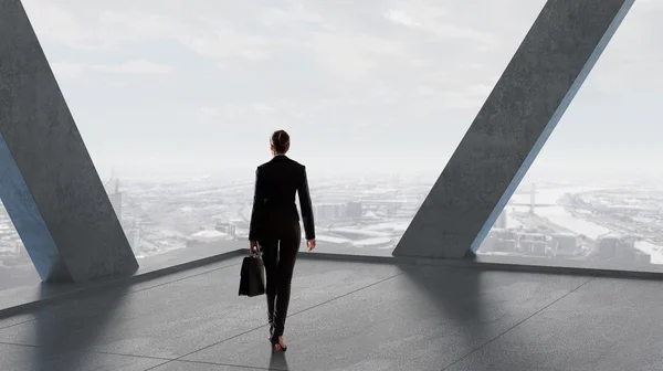 Businesswoman in building interior . Mixed media — Stock Photo, Image