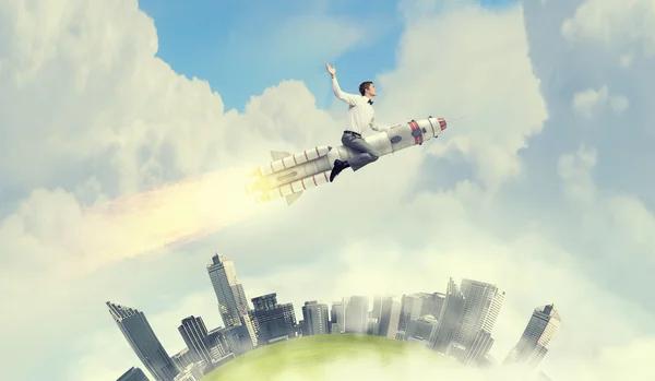 Man riding missile . Mixed media — Stock Photo, Image