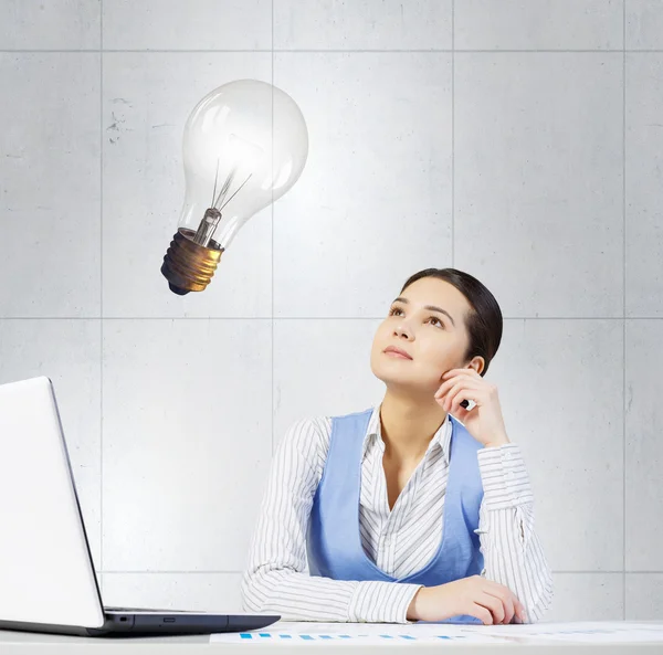 Woman thinking over her project . Mixed media Stock Image