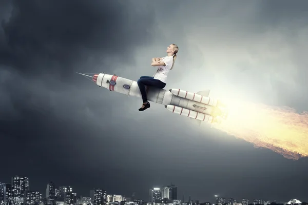 Woman riding missile . Mixed media — Stock Photo, Image