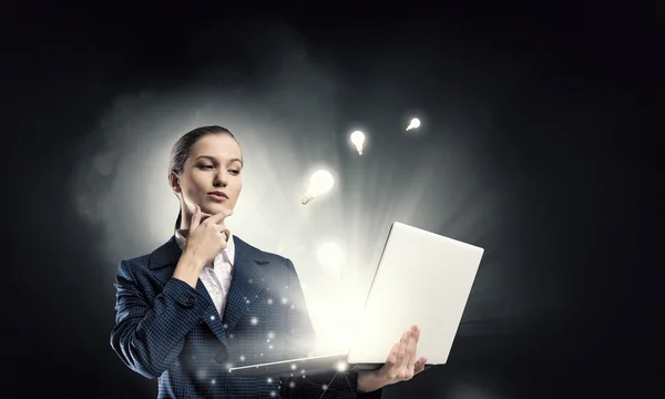 Woman with laptop in hands . Mixed media — Stock Photo, Image