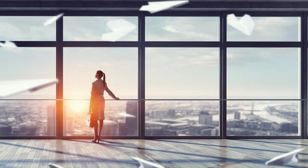 Businesswoman in modern office interior . Mixed media — Stock Photo, Image