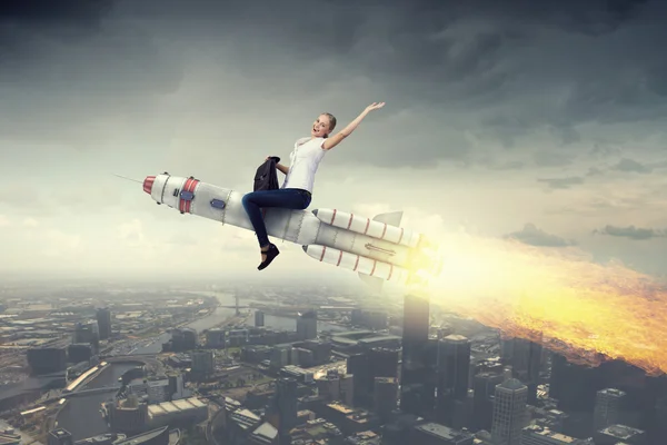 Woman riding missile . Mixed media — Stock Photo, Image