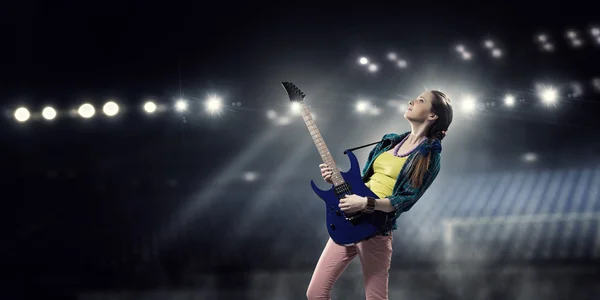 Female rock guitarist . Mixed media — Stock Photo, Image