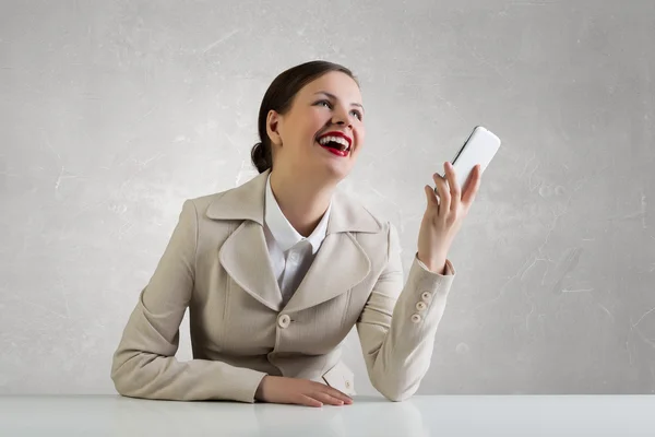 Attractive businesswoman having mobile conversation . Mixed media — Stock Photo, Image