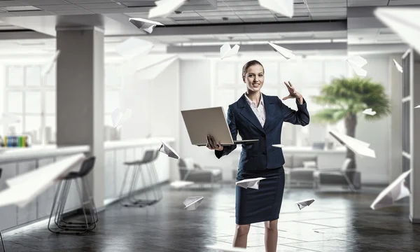 Woman with laptop in hands  . Mixed media — Stock Photo, Image