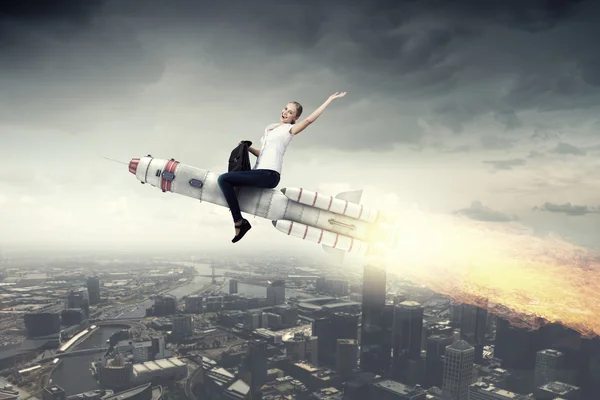 Woman riding missile . Mixed media — Stock Photo, Image