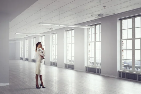 Businesswoman in modern office  . Mixed media — Stock Photo, Image