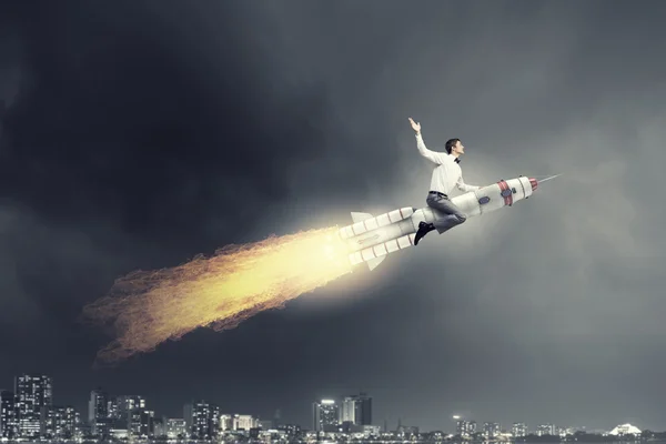 Man riding missile . Mixed media — Stock Photo, Image