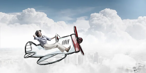 Woman in drawn airplane . Mixed media — Stock Photo, Image