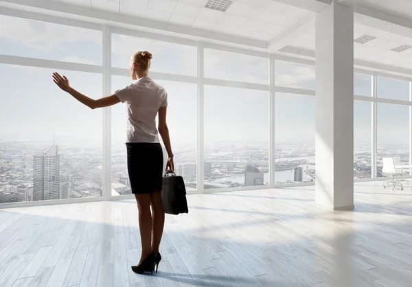 Businesswoman in office  . Mixed media — Stock Photo, Image