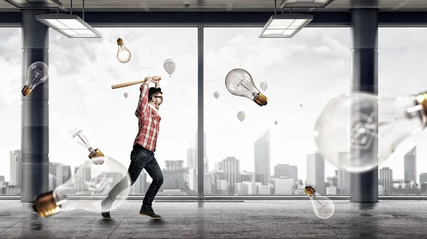 Young man with bat . Mixed media — Stock Photo, Image