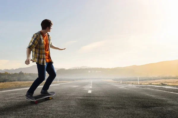 Boy ride skateboard . Mixed media — Stock Photo, Image