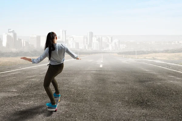 Girl ride skateboard . Mixed media — Stock Photo, Image