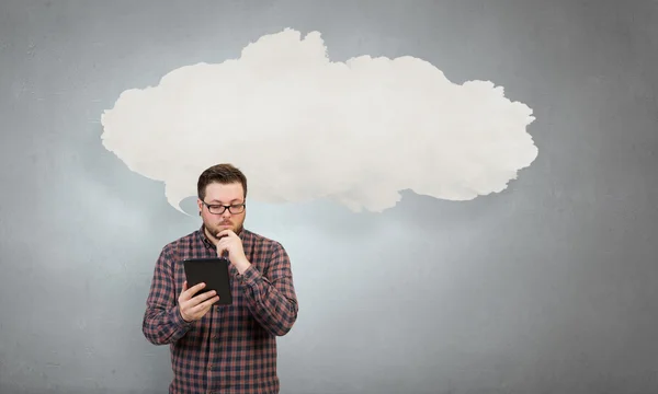 Hipster guy with tablet device . Mixed media — Stock Photo, Image