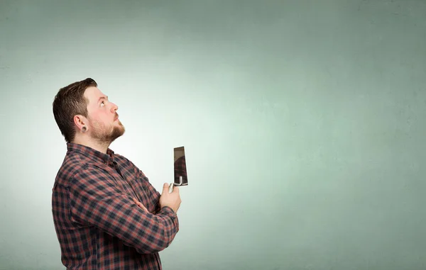 Handyman with tool in interior . Mixed media — Stock Photo, Image