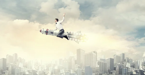 Man riding missile . Mixed media — Stock Photo, Image