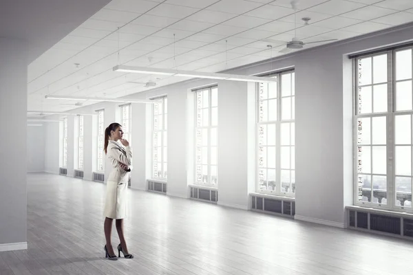 Businesswoman in modern office  . Mixed media — Stock Photo, Image